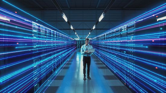 IT technical engineer man laptop in data server room